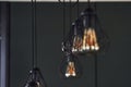 Modern designed light bulbs hangs on the wall indoors. Decoration and domestic life