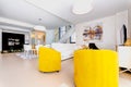 Modern designed room with yellow chairs Royalty Free Stock Photo