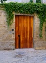 Modern designer entrance door made of wooden elements and installed in an old house in the city of Jaffa Israel Royalty Free Stock Photo