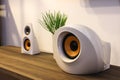 Modern designer speakers on wooden sideboard Royalty Free Stock Photo