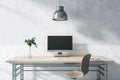 Modern designer wooden desktop with empty computer screen, lamp, decorative plant, chair and concrete wall background. Mock up, 3D Royalty Free Stock Photo