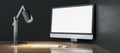 Modern designer wooden desktop with empty white mock up computer monitor, lamp and keyboard. Royalty Free Stock Photo