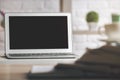 Modern desk with white laptop screen Royalty Free Stock Photo