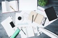 Modern desk with empty tablet and smartphone Royalty Free Stock Photo