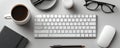 Modern desk workspace with computer keyboard and coffee mug Royalty Free Stock Photo