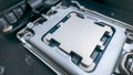 Modern desktop processor installed in motherboard socket, close up of cpu contact plate and high performance computer hardware Royalty Free Stock Photo