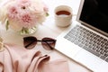 Laptop, Coffee Cup, Sunglasses, Pink Scarf, and Chic Plant Composition