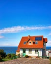 Modern detached house with red roof tiles and solar panels. Living overlooking the Baltic Sea on the island of RÃÂ¼gen Royalty Free Stock Photo