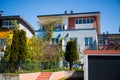 Modern detached houses with flat roof and garage