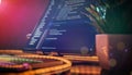 Modern developer setup featuring a monitor with Python code, RGB keyboard, decorative lighting, and a potted plant on the desk. Royalty Free Stock Photo