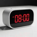 Modern Digital Alarm Clock Displaying 08:00 AM in Red LED Lights digital clock time Royalty Free Stock Photo