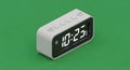 Digital clock displaying 10:25 on a green background, modern design, time display Royalty Free Stock Photo