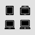 Modern digital device icons set featuring a tablet, monitor, and two laptop variations Royalty Free Stock Photo