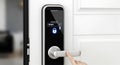 A modern digital door lock with a sleek, black touchscreen panel displays a Royalty Free Stock Photo