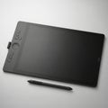 Modern digital drawing tablet with stylus Royalty Free Stock Photo