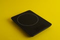 Modern digital kitchen scale on yellow background Royalty Free Stock Photo