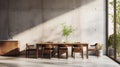 Modern dining area featuring spacious wooden table in sleek kitchen with concrete backdrop