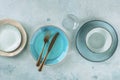 Modern dinnerware with cutlery. A vibrant blue plate with a fork and a knife Royalty Free Stock Photo