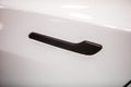 Modern door handle of a white car Royalty Free Stock Photo