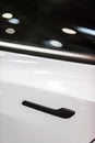 Modern door handle of a white car Royalty Free Stock Photo
