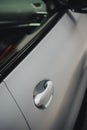 Modern door handle of a white car Royalty Free Stock Photo