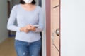 Modern doornkop and key with blurred woman inspector at new house,Door knob locks with keys Royalty Free Stock Photo
