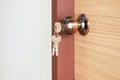 Modern doornkop and key at new house,Door knob locks with key Royalty Free Stock Photo