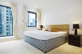 Modern double bedroom with king size bed Royalty Free Stock Photo