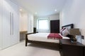 Modern double bedroom with king size bed Royalty Free Stock Photo