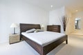 Modern double bedroom with king size bed Royalty Free Stock Photo