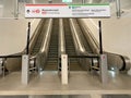 Modern double escalator staircase in shopping mall leading up