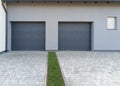 Modern double garage with paved driveway Royalty Free Stock Photo