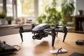 Modern drone with a video camera on a wooden table