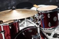 Modern drum set on black background in room Royalty Free Stock Photo