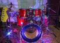 Modern drum set on stage prepared for playing in bright blue light Royalty Free Stock Photo