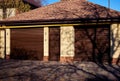 Modern duplex garage door with separate entrance. Large automatic up and over door. Close- up photo, natural light