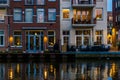 Modern Dutch buildings at the canal, City architecture by night, Alphen aan den Rijn, the Netherlands