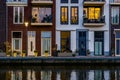 Modern dutch houses at the canal, city architecture by night, Alphen aan den Rijn, The Netherlands Royalty Free Stock Photo