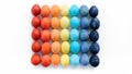 Modern easter concept. Colored eggs laid out in a square by color on a white background with copy space. Contemporary art easter