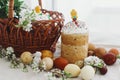 Modern easter eggs, Easter bread, basket, bunny and spring flowers on rustic table. Happy Easter Royalty Free Stock Photo