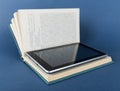 Modern ebook reader in traditional book Royalty Free Stock Photo
