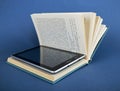 Modern ebook reader in traditional book Royalty Free Stock Photo