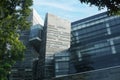 Modern eco-friendly glass architecture facade and greens against blue sky Royalty Free Stock Photo