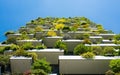 Modern and ecologic skyscrapers with many trees on every balcony Royalty Free Stock Photo