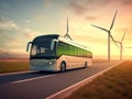 Modern electric bus on the track overlooking the electric wind farms. The concept of environmental protection. Royalty Free Stock Photo