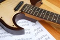 Modern electric guitar and music sheets Royalty Free Stock Photo