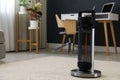 Modern electric halogen heater on floor in room interior Royalty Free Stock Photo