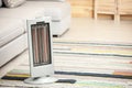 Modern electric infrared heater on floor. Space for text Royalty Free Stock Photo