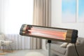 Modern electric infrared heater at home Royalty Free Stock Photo