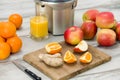 Modern electric juicer, various fruit and glass of freshly made juice, healthy lifestyle Royalty Free Stock Photo